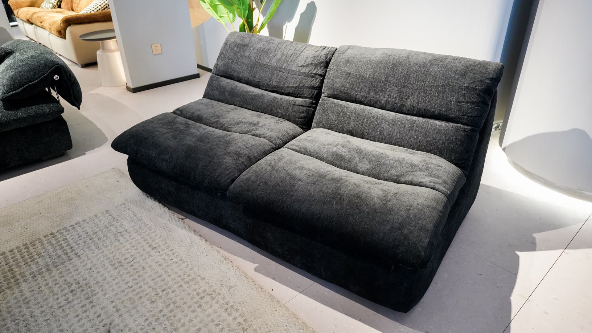 The Wombat Black - Back view - Compressed sofa that fits in your car